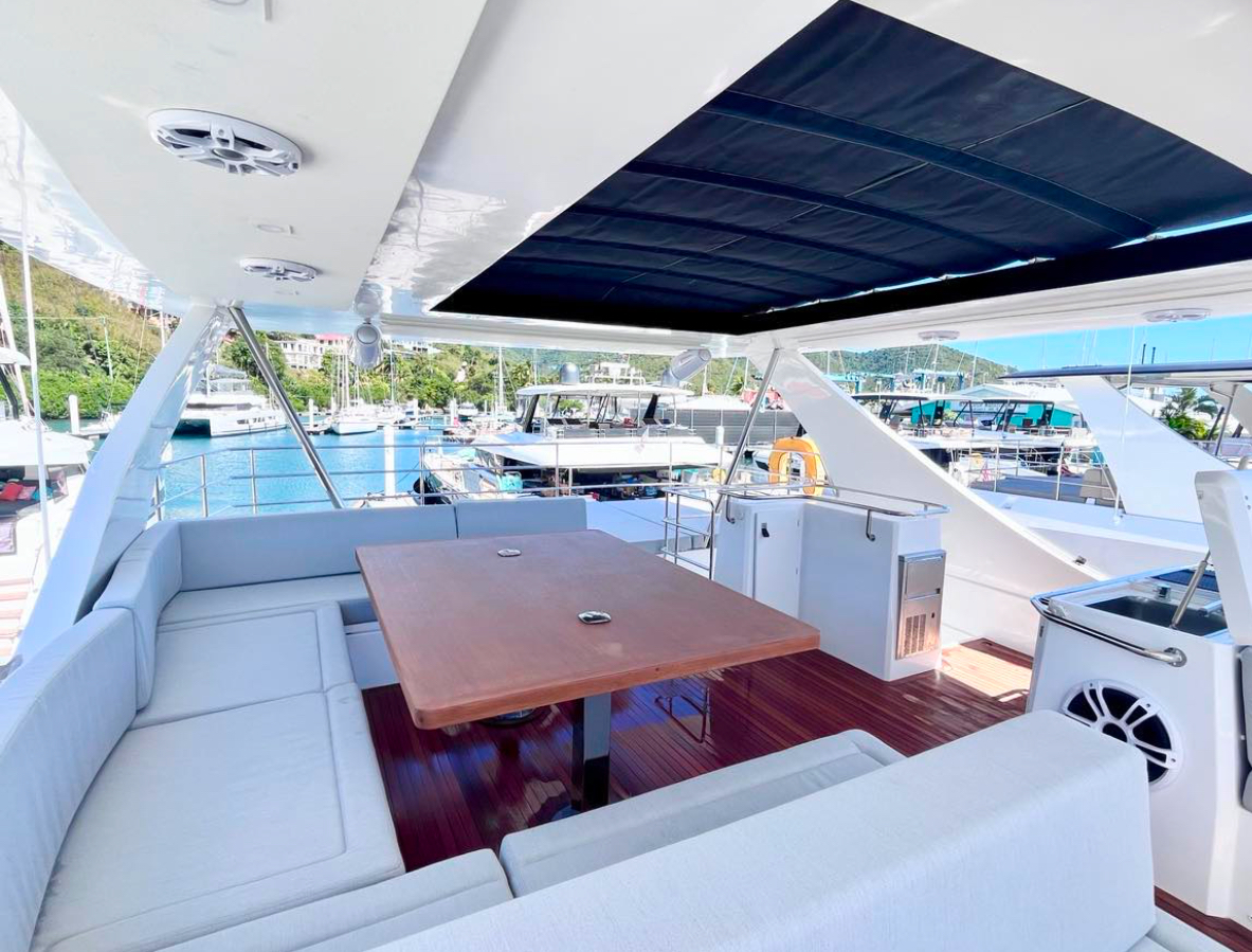 Yachti By Nature flybridge lounge with shaded upper deck seating